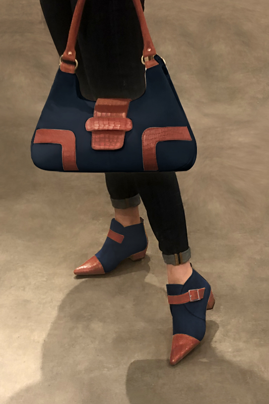Terracotta orange and navy blue women's ankle boots with buckles at the front. Tapered toe. Low cone heels. Worn view - Florence KOOIJMAN